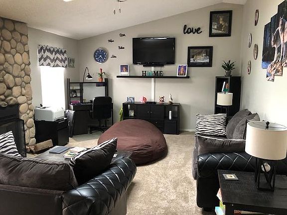Family room has wood burning fireplace