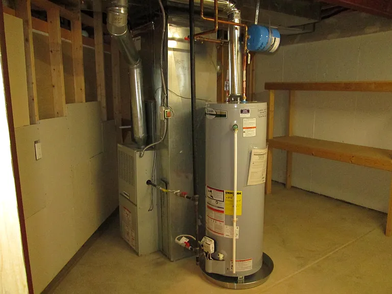 Gas furnace with humidifier, newer water heater, extra shelving