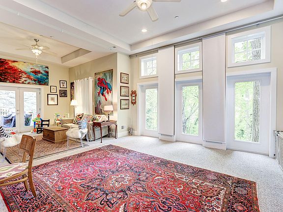 12-foot windows bring in lots of natural light. Flexible floor plan has space for living + dining or large double parlor.