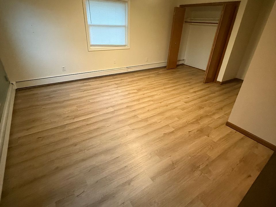 View of master bed from walk-in closet