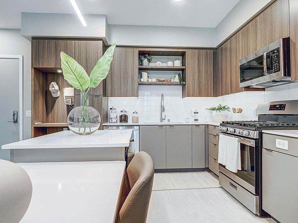 Griffis Platinum Triangle apartment kitchen with quartz countertops.