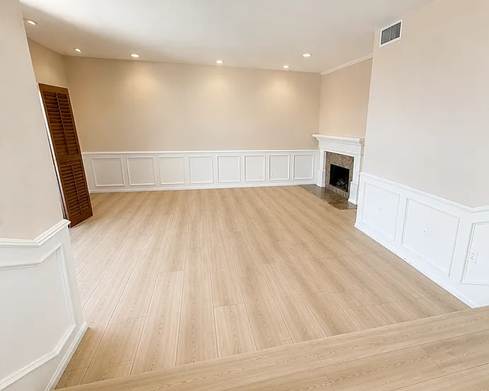 Newly painted and new floors (to be installed); large step down living room with fireplace; bright with high ceilings