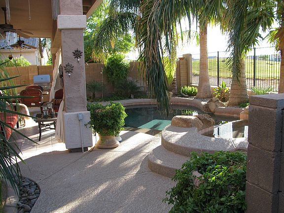 backyard pool with heated spa