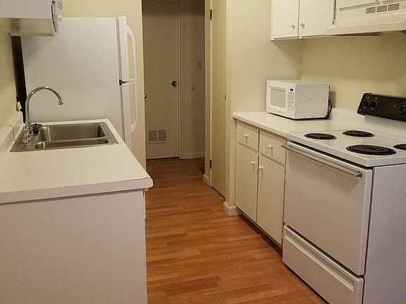 Kitchen includes Electric Range, Microwave, and Pantry