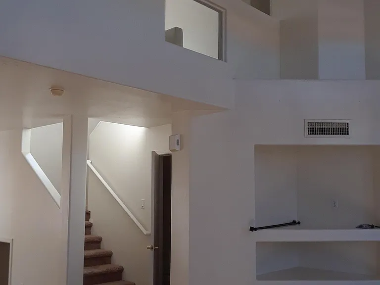 Bathroom downstairs (sink,toilet)
(next to the steps-open door)