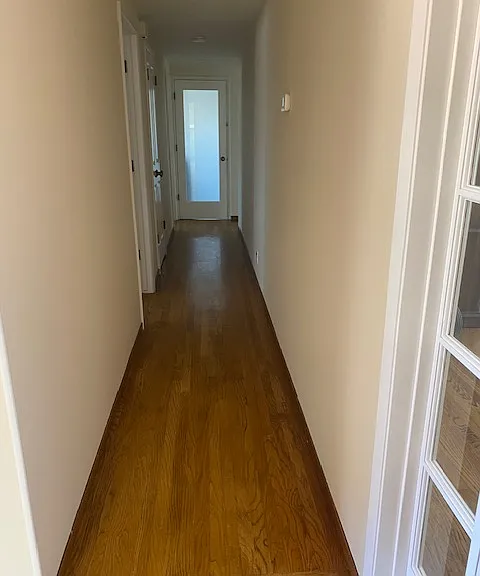 Hall off entry leading to bedrooms and laundry rooms