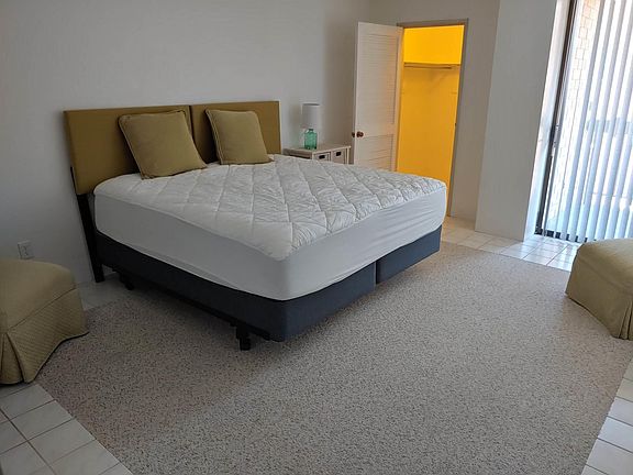 King Size New Bed with Chairs and Walk in Closet in Bedroom
