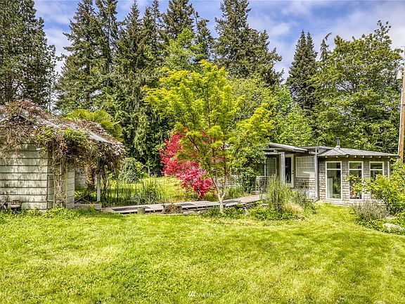 The cottage sits on the level open area of the property.  