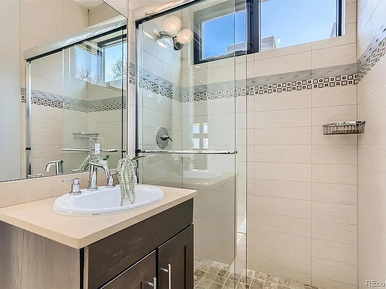 top floor / roof deck bathroom enabling this top floor to also be used as a flex fourth bedroom
