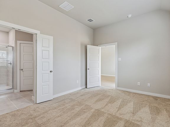 Primary Suite in the Birch home plan by Trophy Signature Homes - REPRESENTATIVE PHOTO