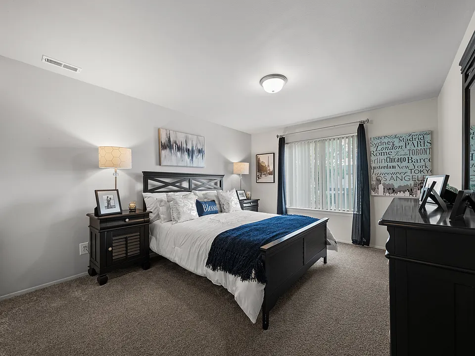 Spacious bedroom with ample storage space at Knottingham Apartments in Clinton Township, MI.