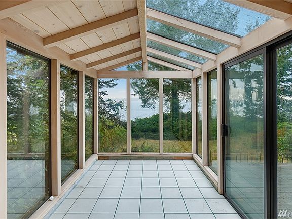 Atrium facing backyard and water. 
