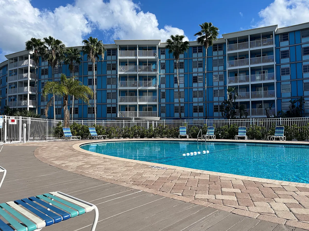 Umbrellas surround pool for shade and free access to noodles and floaties. - 3315 58th Ave S #409