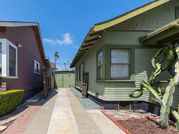 Front of house with driveway gate opened
