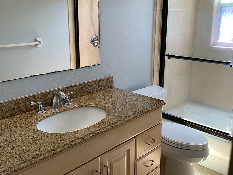Bath with solid surface vanity top