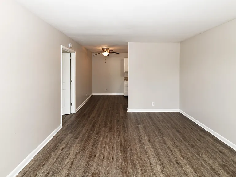 Spacious living room with hardwood-style flooring