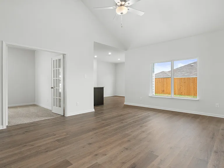 The family room has a large window that lets in great, natural light.