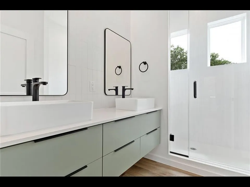 Full-bathroom #1 with 2 sinks, standing shower, and toilet
