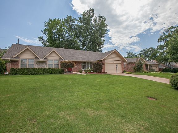 Manicured lawn with sprinkler system.