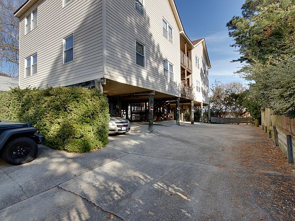 View of Outside of Building. Four units in this building. Unit #1 being the unit with the vehicle parked directly under the unit.1 Designated "Off Street" Parking Space