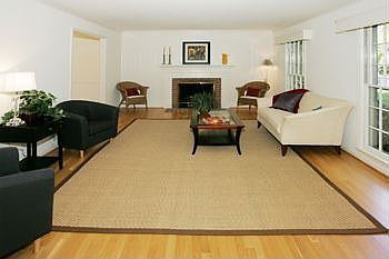 Spacious living room with wood burning fireplace