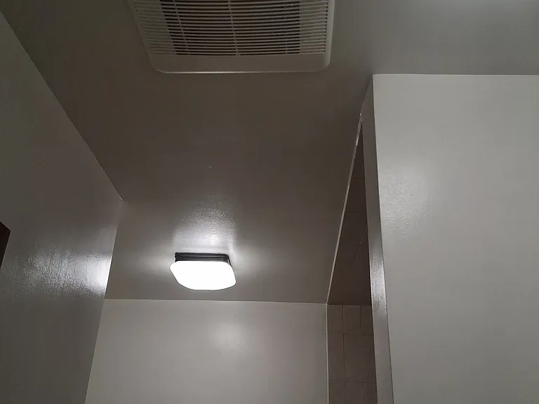 Bathroom. Dual lighting plus air vent.