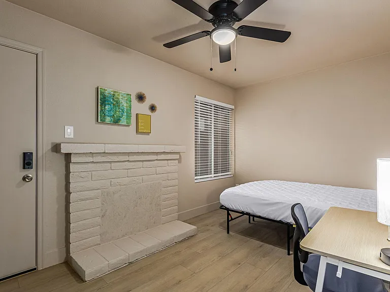 Actual bedroom: queen bed, desk, chair, lamp, fan, closet. PRIVATE ENTRANCE