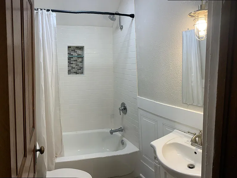 2nd floor Bathroom completely gutted, tiled shower area, blue tooth enabled speaker/light in the bathroom