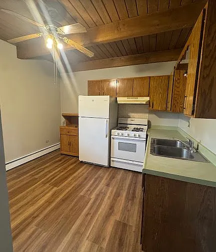 Kitchen has a shared balcony out the back door