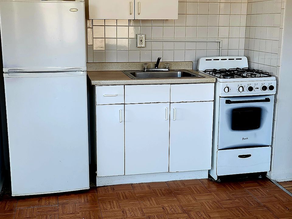 Eat-in kitchen with large area for table, chairs and bar stools.