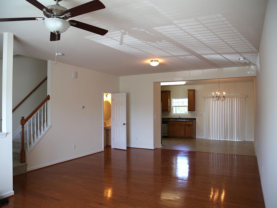 View of the Living Room, looking back toward dining room with sliding glass doors opening up onto the patio.