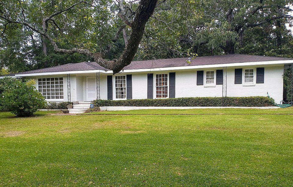 
Wrought iron and gray brick