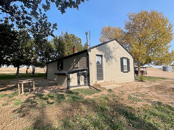 Back of house, back door, and parking spot