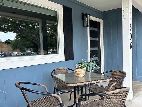 Seating area on front porch. You can see the top of the historic courthouse from the porch.