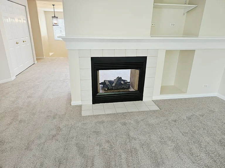 Two sided gas log fireplace