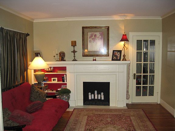 Living room with built-in bookshelves and fireplace
