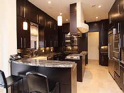 The stone farm sink, the dual zone wine chiller, the large built-in refrigerat