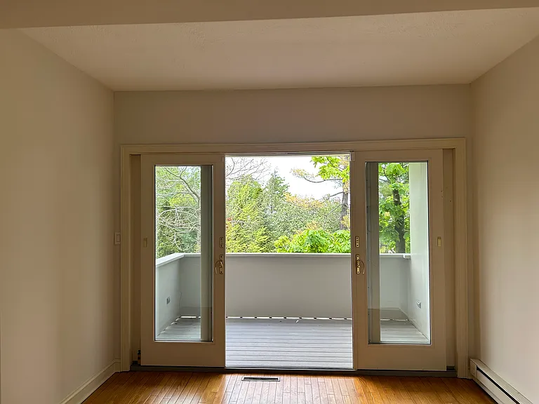 Sliding doors invite the extended dining room to enjoy a covered porch