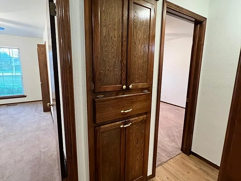 Storage above and laundry drawer under.