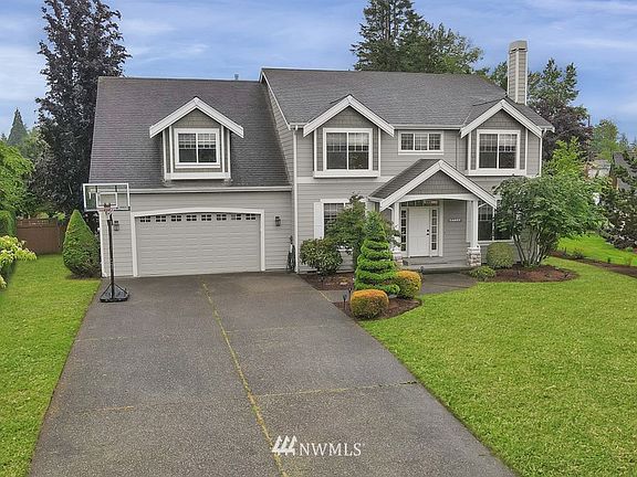 Sitting on a shy 1/2 acre lot ~ this home has room for everyone!