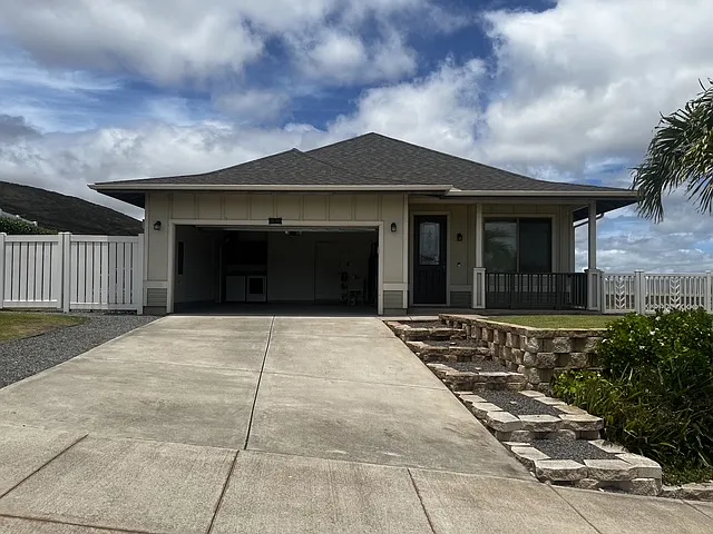 View of garage and driveway from the front of the home