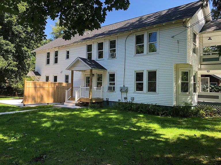 Front and side entries. New porch and steps.