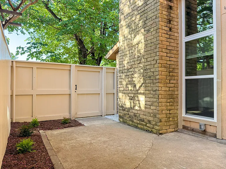 Fenced front courtyard