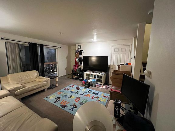 Spacious living room with slider to deck.
