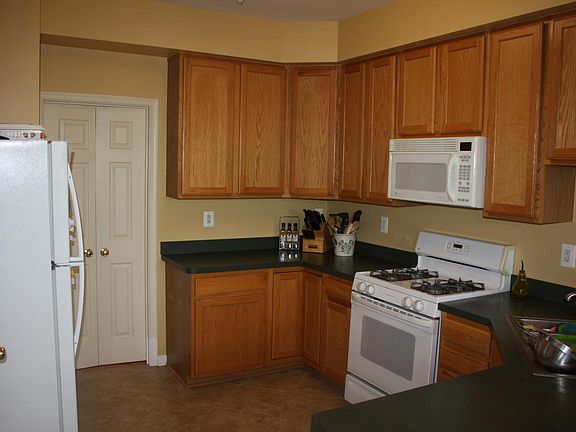 Open kitchen, large cabinets, high ceilings