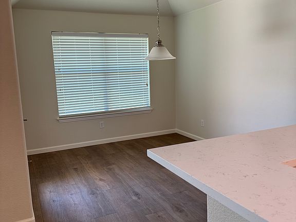 Breakfast area, with new LVP flooring, new baseboards and freshly painted