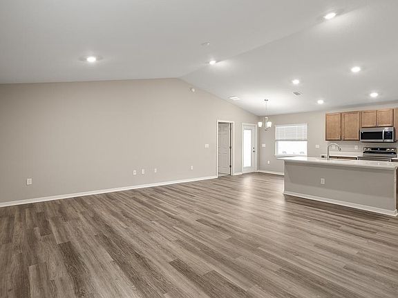 Enjoy a spacious and open living area - Begonia by Highland Homes