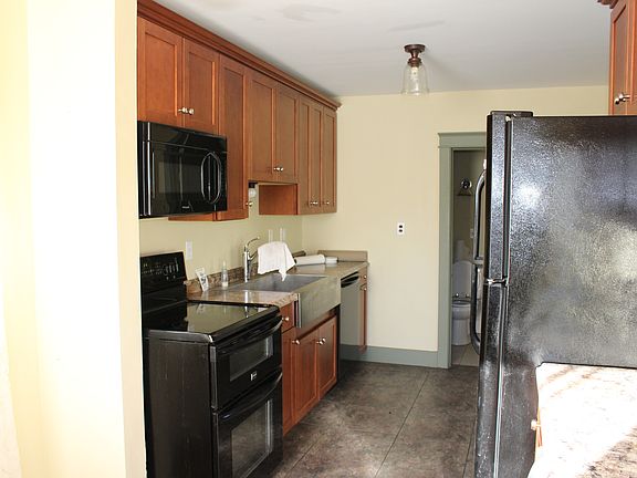 Kitchen with farmers sink and wine cooler