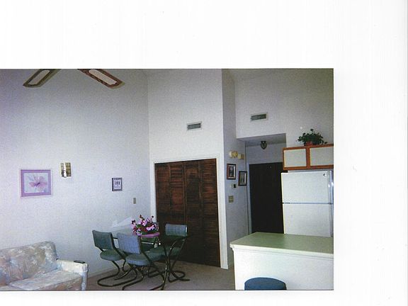 Dining Area, behind the louver doors are the stackable washe