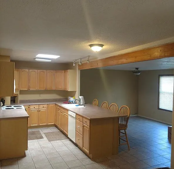 side view of kitchen and dining